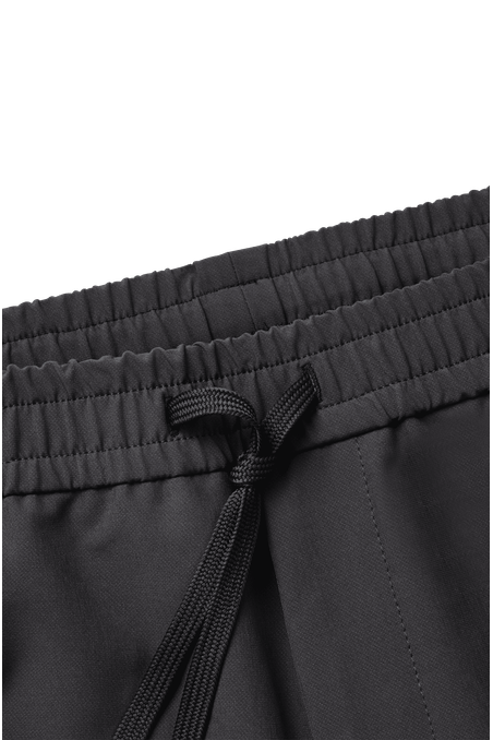 PANTALÓN TAPERED FIT EN TEJIDO MULTIELÁSTICO HOMBRE