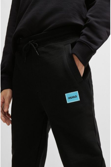 PANTALONES DE BUZO REGULAR FIT EN FELPA DE ALGODÓN CON ETIQUETA CON LOGO HOMBRE