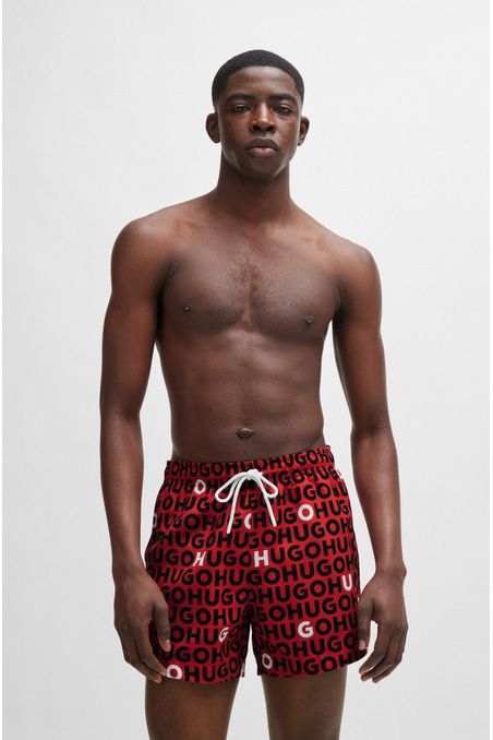 TRAJE DE BAÑO TIPO SHORTS CON FORRO INTEGRAL Y LOGOS REPETIDOS HOMBRE