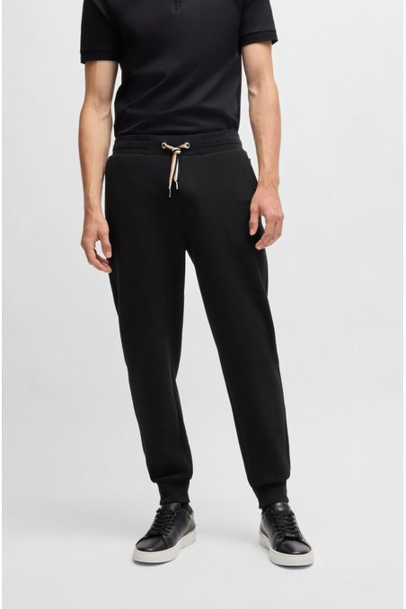 PANTALONES DE CHÁNDAL DE ALGODÓN CON RAYAS DE LA MARCA EN EL CORDÓN PANTALONES REGULAR FIT HOMBRE