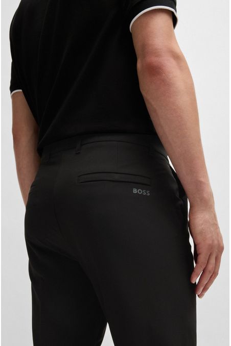 PANTALONES REGULAR FIT DE TEJIDO ELÁSTICO REPELENTE AL AGUA PANTALONES CASUALES REGULAR FIT HOMBRE