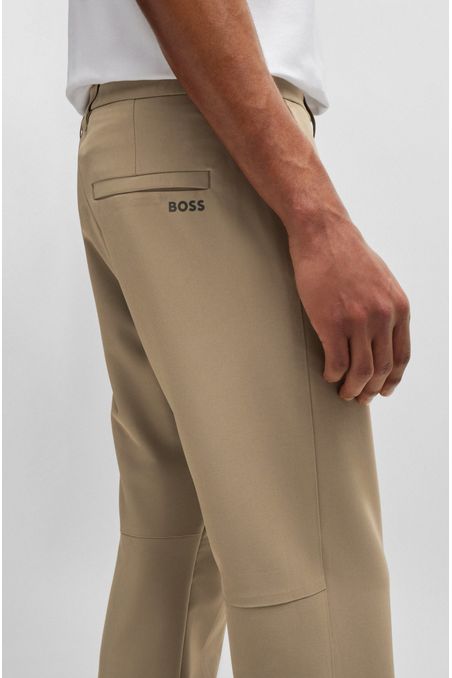 PANTALONES REGULAR FIT DE TEJIDO ELÁSTICO REPELENTE AL AGUA PANTALONES CASUALES REGULAR FIT HOMBRE