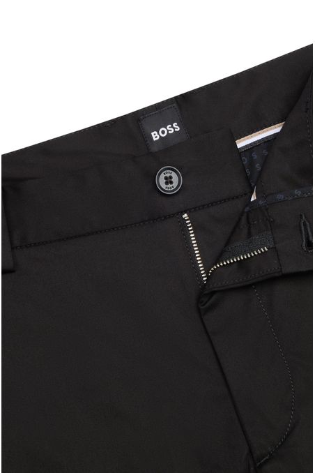 PANTALONES REGULAR FIT DE TEJIDO ELÁSTICO REPELENTE AL AGUA HOMBRE