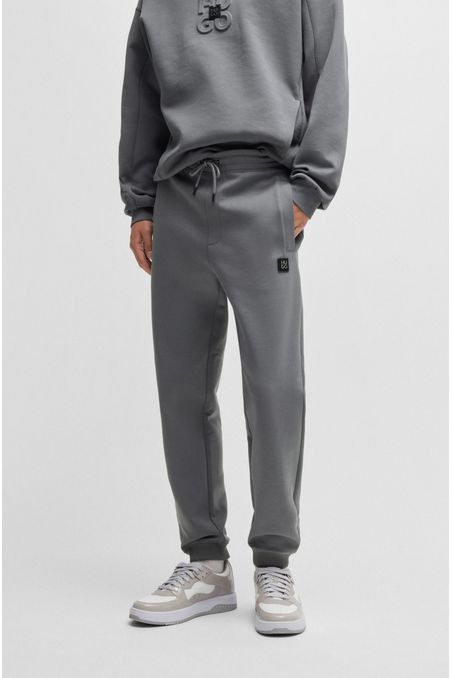 PANTALONES DE CHÁNDAL DE ALGODÓN CON LOGO APILADO PANTALONES RELAXED FIT HOMBRE