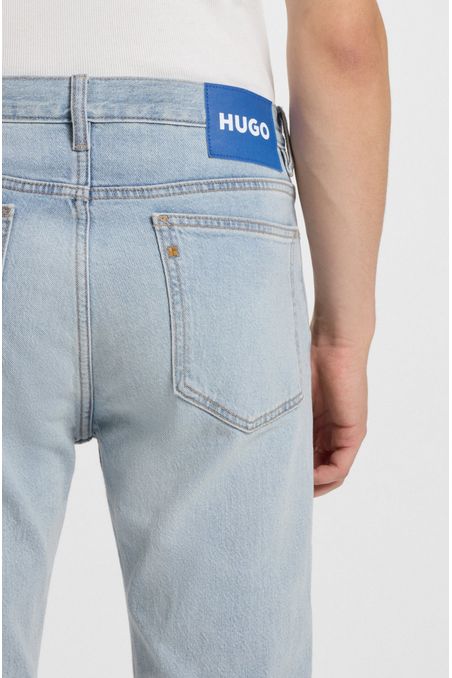 JEANS SLIM FIT DE DENIM AZUL LAVADO A LA PIEDRA JEANS SLIM FIT HOMBRE