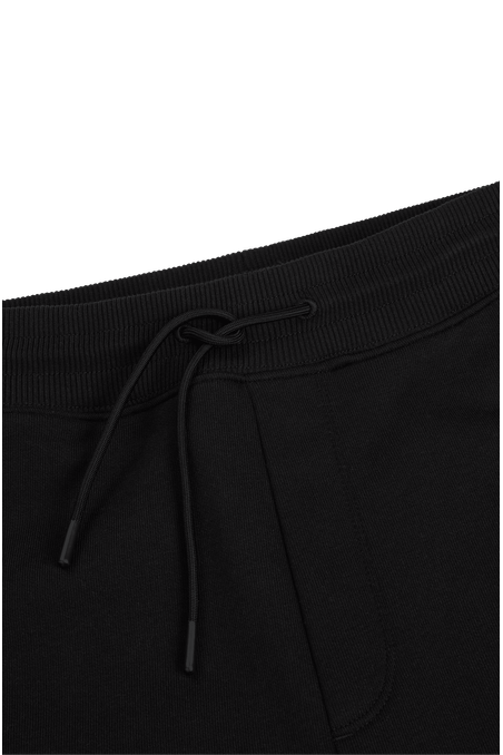 PANTALONES DE BUZO RELAXED FIT CON ESTAMPADO HOMBRE